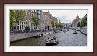 Framed Tourboats in a canal, Amsterdam, Netherlands