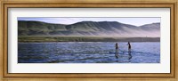 Framed Tourists paddleboarding in the pacific ocean, Santa Cruz Island, Santa Barbara County, California