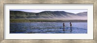Framed Tourists paddleboarding in the pacific ocean, Santa Cruz Island, Santa Barbara County, California