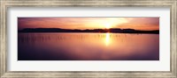 Framed Reflection of sun on water at dawn, Elephant Butte Lake, New Mexico, USA
