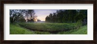 Framed Green field with university building in the background, King's College, Cambridge, Cambridgeshire, England