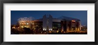 Framed Football stadium lit up at night, Old Trafford, Greater Manchester, England