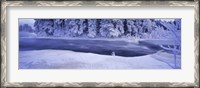 Framed River flowing through a snow covered forest, Dal River, Sweden