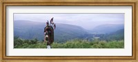 Framed Bagpiper at Loch Broom in Scottish highlands, Ross and Cromarty, Scotland