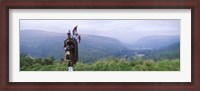 Framed Bagpiper at Loch Broom in Scottish highlands, Ross and Cromarty, Scotland
