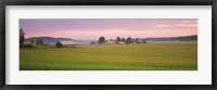 Framed Barn and wheat field across farmlands at dawn, Finland