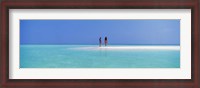 Framed Two women standing on the beach sandbar, Maayafushi Island, Ari Atoll, Maldives