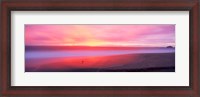 Framed Sunset light painting waves across sandy shore on beach, Laguna Beach, California, USA