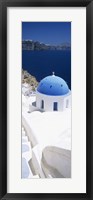 Framed High angle view of a church with blue dome, Oia, Santorini, Cyclades Islands, Greece