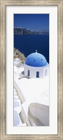 Framed High angle view of a church with blue dome, Oia, Santorini, Cyclades Islands, Greece