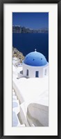 Framed High angle view of a church with blue dome, Oia, Santorini, Cyclades Islands, Greece