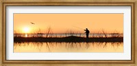 Framed Silhouette of a man fishing