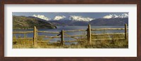 Framed Fence in front of a lake with mountains in the background, Lake General Carrera, Andes, Patagonia, Chile