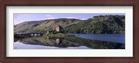 Framed Eilean Donan Castle with reflection in the water, Highlands Region, Scotland
