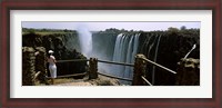 Framed Woman looking at the Victoria Falls from a viewing point, Zambia