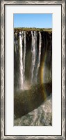 Framed Rainbow forms in the water spray in the gorge at Victoria Falls, Zimbabwe