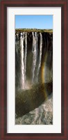 Framed Rainbow forms in the water spray in the gorge at Victoria Falls, Zimbabwe