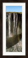 Framed Rainbow forms in the water spray in the gorge at Victoria Falls, Zimbabwe