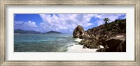 Framed Rock formations on the beach on Anse Source d'Argent beach with Praslin Island in the background, La Digue Island, Seychelles
