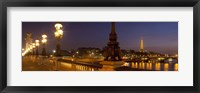 Framed Bridge across the river lit up at dusk, Pont Alexandre III, Seine River, Paris, Ile-De-France, France