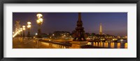 Framed Bridge across the river lit up at dusk, Pont Alexandre III, Seine River, Paris, Ile-De-France, France