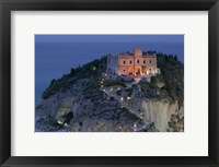 Framed High angle view of a church lit up at dusk on a cliff, Santa Maria dell Isola, Tropea, Calabria, Italy