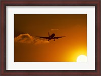 Framed Silhouette of airliner in golden sunset