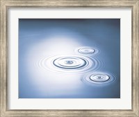 Framed Three rings in grey tinted water with bright light