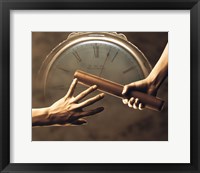 Framed Close up of two runners hands passing the baton in relay race in front of old European clock face