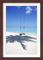 Framed Swing on the beach above palm tree shadow