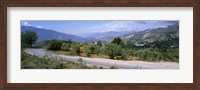 Framed Road passing through a landscape with mountains in the background, Andalucian Sierra Nevada, Andalusia, Spain