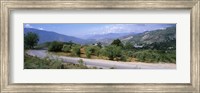 Framed Road passing through a landscape with mountains in the background, Andalucian Sierra Nevada, Andalusia, Spain