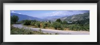 Framed Road passing through a landscape with mountains in the background, Andalucian Sierra Nevada, Andalusia, Spain
