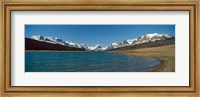 Framed Lake with snow covered mountains in the background, Sherburne Lake, US Glacier National Park, Montana, USA