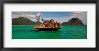 Framed Rock in Indian Ocean with mountain the background, Le Morne Mountain, Mauritius Island, Mauritius