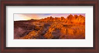 Framed Alpenglow on rock formations at sunrise, Door Trail, Badlands National Park, South Dakota, USA