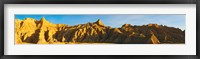 Framed Rock formations on a landscape in golden light, Saddle Pass Trail, Badlands National Park, South Dakota, USA