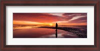 Framed Silhouette of human sculpture on the beach at sunset, Another Place, Crosby Beach, Merseyside, England