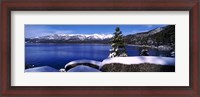 Framed Lake with a snowcapped mountain range in the background, Sand Harbor, Lake Tahoe, California, USA