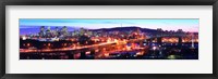 Framed Jacques Cartier Bridge with city lit up at dusk, Montreal, Quebec, Canada 2012
