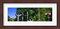Framed Totem poles in a a park, Stanley Park, Vancouver, British Columbia, Canada
