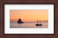 Framed Tugboat and a tall ship in the Baie de Douarnenez at sunrise, Finistere, Brittany, France