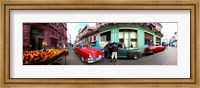 Framed 360 degree view of old cars and fruit stand on a street, Havana, Cuba