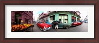 Framed 360 degree view of old cars and fruit stand on a street, Havana, Cuba