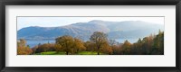 Framed Autumn trees with mountains in background, Derwent Water, Lake District National Park, Cumbria, England