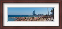 Framed Tourists on the beach with W Barcelona hotel in the background, Barceloneta Beach, Barcelona, Catalonia, Spain