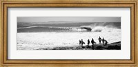 Framed Silhouette of surfers standing on the beach, Australia (black and white)