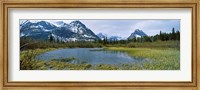 Framed Lake with mountains in the background, US Glacier National Park, Montana, USA