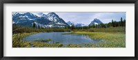 Framed Lake with mountains in the background, US Glacier National Park, Montana, USA