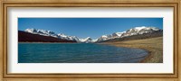 Framed Lake with snow covered mountains in the background, Sherburne Lake, US Glacier National Park, Montana, USA